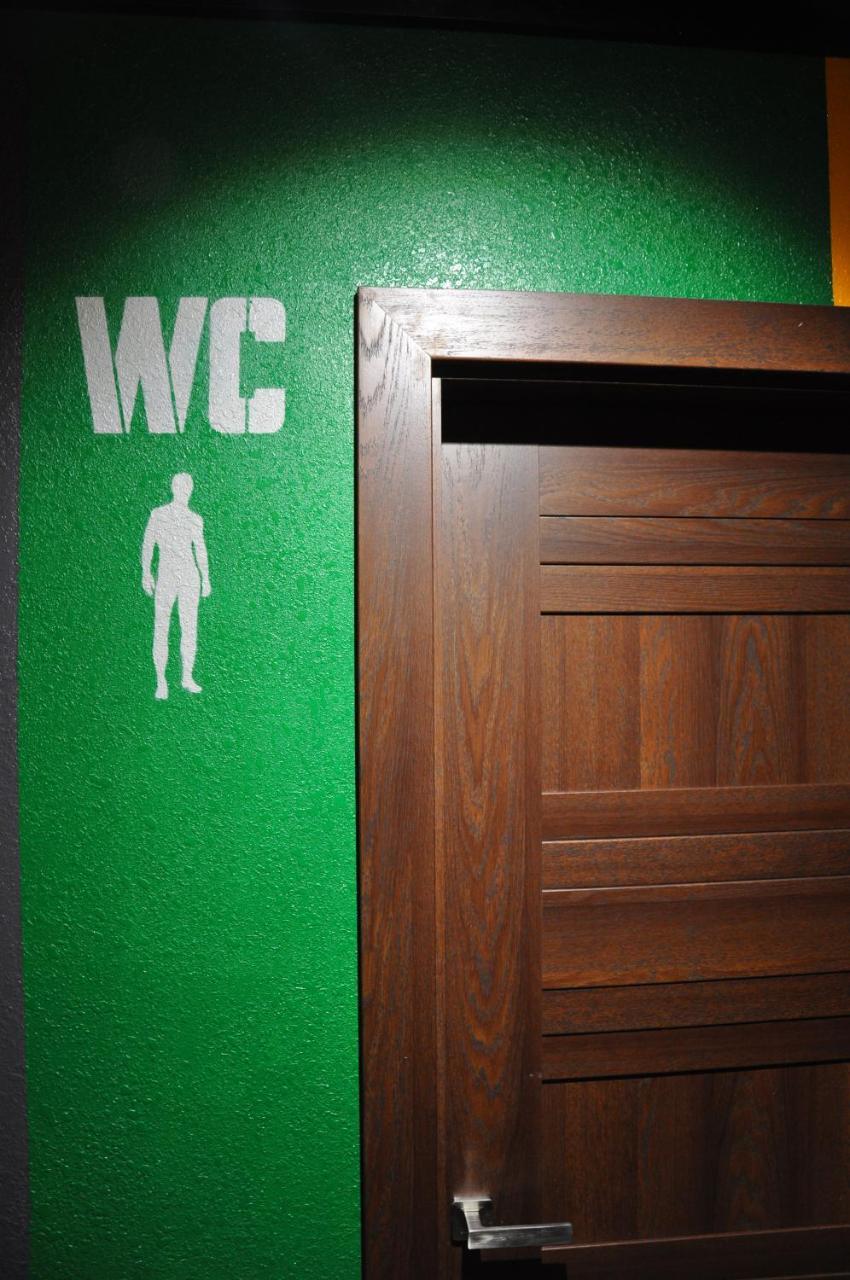 Full House Capsule Hostel Ривне Екстериор снимка A sign for a men's toilet
