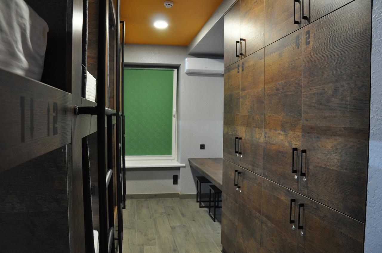 Full House Capsule Hostel Ривне Екстериор снимка A typical student bedroom
